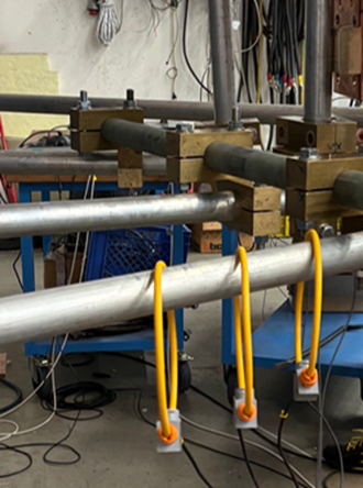 Photograph of an installation with three Rogowski coils in the foreground.